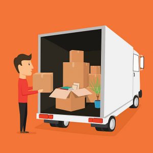 Man loading a moving truck, preparing to help you with moving from Canada to Brazil.