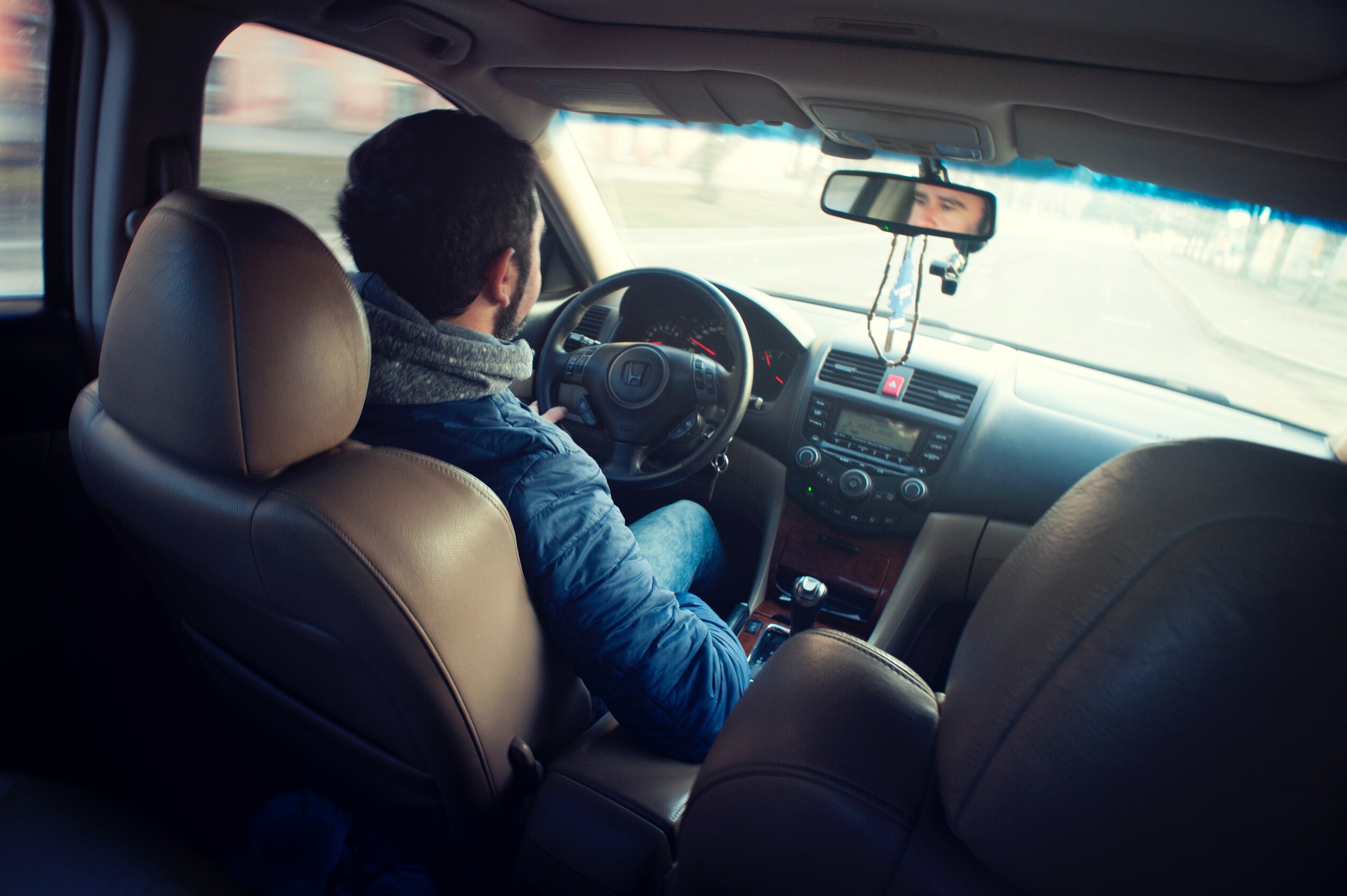 A driver driving his car after moving to Brazil from the UK.