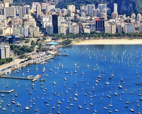 Buildings, bright sky and a lot of boats in the sea